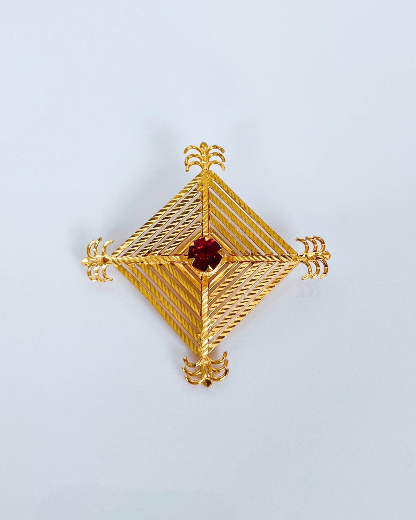 Silam Sakhma Handcrafted Gold Plated Brooch – Deep Red Stone